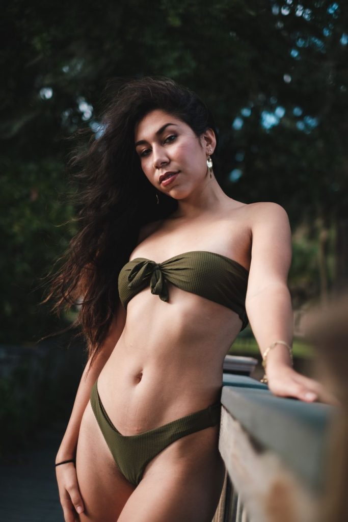 Woman in a bikini by the water