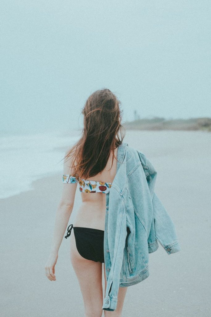 Woman in a bikini by the water